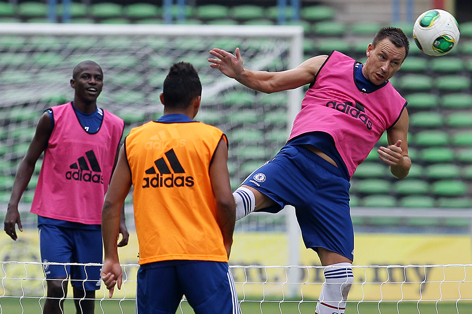 Chelsea's captian, John Terry ( R ) heads the ball during a training session at the Shah Alam Stadium, outside Kuala Lumpur today. Chelsea team will play friendly with Malaysia XI team tomorrow. JUL 20, 2013. Photo SINAR HARIAN/Safwan Mansor